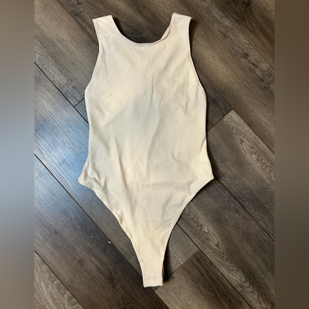 Women’s free people bodysuit. NWOT. Medium.